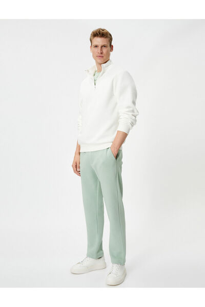 Koton Παντελόνι με φαρδύ πόδι με λεπτομέρεια στην τσέπη και δεμένη μέση