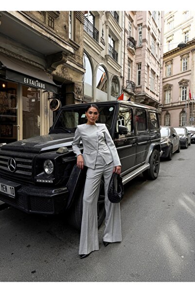 OUZ Fashion طقم بنطلون وسترة مبطنة بأزرار غير متماثلة من Poliviskon للسيدات