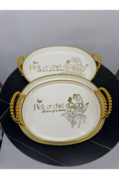 Living 3-piece oval teapot set, beige with gold handles.