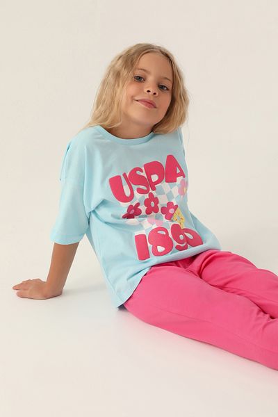 U.S. Polo Assn. Set de pijamale pentru fetiță albastru deschis cu licență