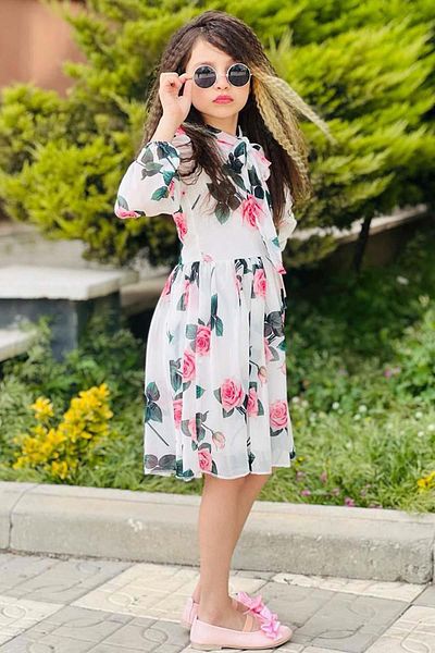 Riccotarz Girl's White Pleated Dress with Tie Collar Detail and Rose Pattern