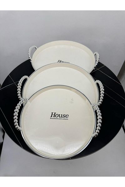 Living 3-piece round teapot set, sugar-colored with silver handles.