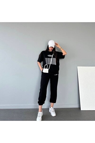 Mythologie بنطلون رياضي وتي شيرت من Coutre - طقم بدلة رياضية سوداء اللون من ت...