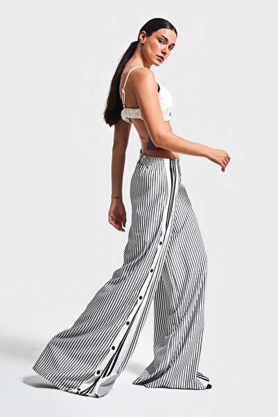 its basic Women's Black Striped Color Side Button Palazzo Fit Loose Cut Design Trousers