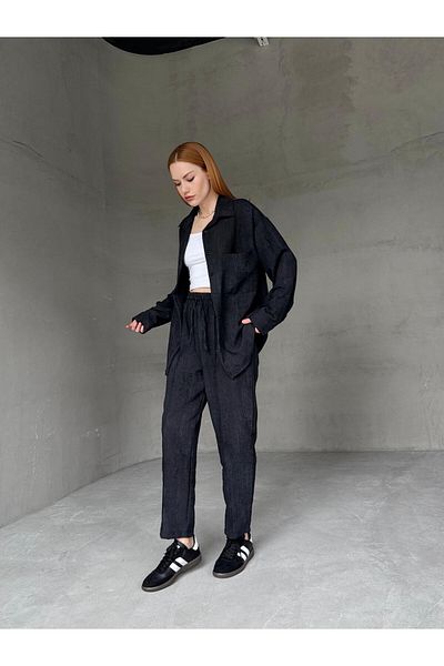 Cappmoda TKM-03659 قميص فضفاض بجيب من القماش المغسول باللون الأسود مع سروال مرن على شكل جزرة وخصر طقم مكون من قطعتين