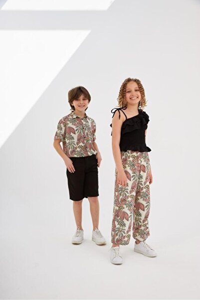 Hilal Akıncı Kids Set de 2 piese pentru fete, bluză neagră cu un singur umăr, pantaloni cu model