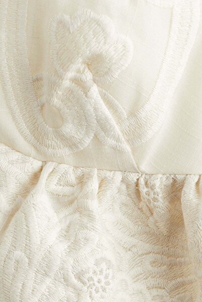 H&M Embroidered peplum top