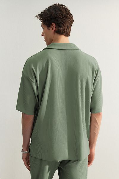 Trendyol Collection Limitierte Auflage - Mintfarbenes, weit geschnittenes, strukturiertes und knitterfreies Ottoman-Polo-T-Shirt TMNSS23PO00020