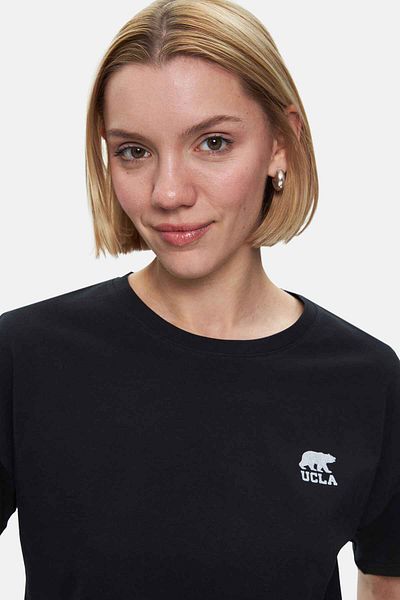 UCLA Tricou de damă Kenzie negru cu decolteu rotund cu imprimeu argintiu