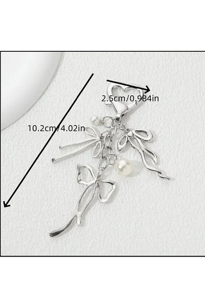 TChic Breloc sau ornament pentru geanta cu fundita de culoare argintie