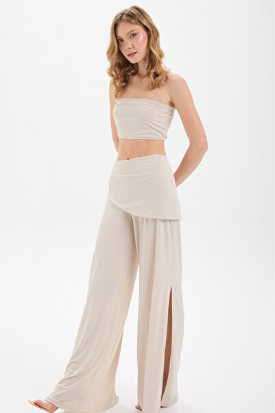 By Yaren Yazıcı Pantaloni largi cu design asimetric în talie bej cu fantă