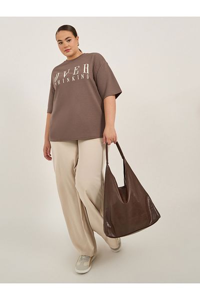 Styli Plus Size Slogan Print Dropped Shoulder Oversized T-Shirt