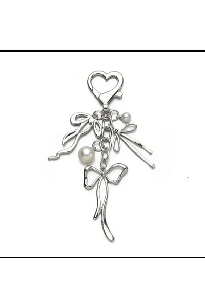 TChic Breloc sau ornament pentru geanta cu fundita de culoare argintie