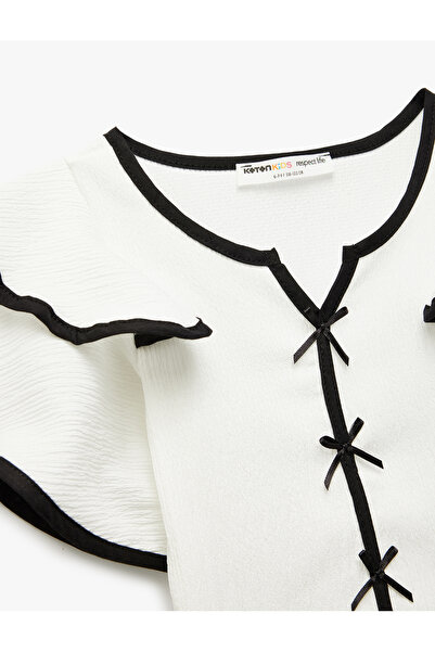 Koton Krátký motýlkový rukáv s výstřihem do V a volánem