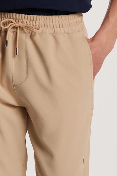 Tudors Ανδρικό Jogger Beige παντελόνι με ελαστική μέση με κορδόνια με χαλαρή εφαρμογή και πλαϊνές τσέπες