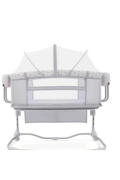Mini Baby Mastela bed next to the mother