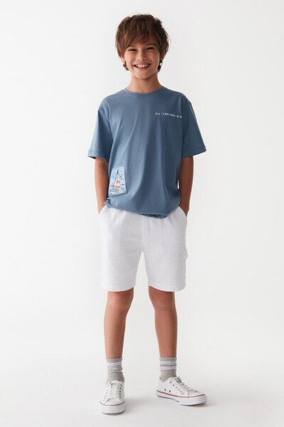 nk kids تي شيرت Deroshkids للأولاد باللون الأزرق مع تفاصيل جيب من الكتان المن...