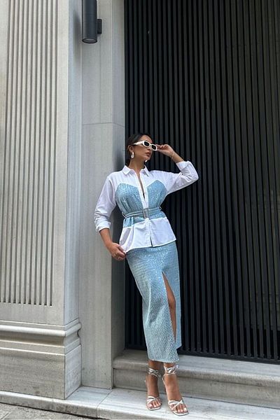 HARVESSE Slit Denim Skirt Embellished with Shimmering Details