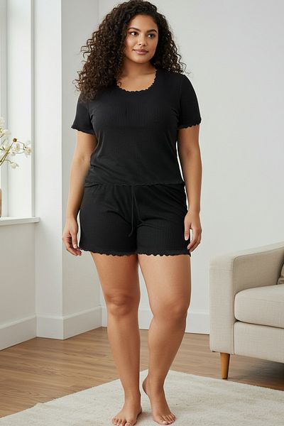 Trendyol Curve Schwarzes, detailliertes, geripptes, gestricktes Baby-Overlock-Pyjama-Set TBBSS25AI00040