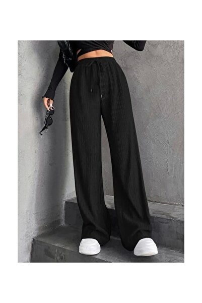 Akm Life Μαύρο γυναικείο παντελόνι με φαρδιά μπατζάκια, ελαστική μέση και υφα...