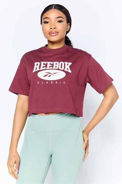 Reebok بلوزة رياضية نسائية بأكمام قصيرة مناسبة للأنشطة الخارجية، لون عنابي