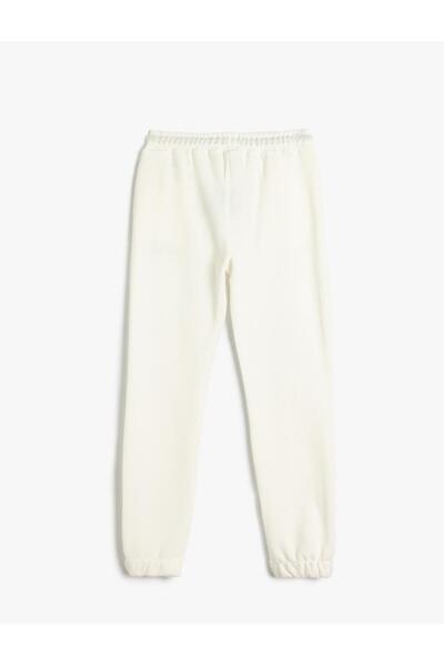 Koton Bavlnené tepláky Jogger s potlačou - vrecká