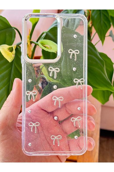 Fibaks حافظة هاتف Xiaomi Redmi Note 14 4G بنمط فيونكة شفافة فضية لامعة مع غطاء لامع للكاميرا