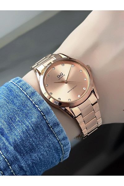 Q&Q Women's Metal Cord Rose Color Stone Dial Wristwatch