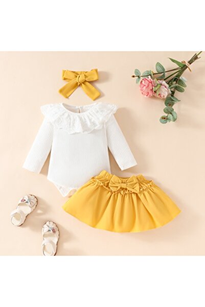 Superbaby Costume with white bodysuit and mustard yellow skirt