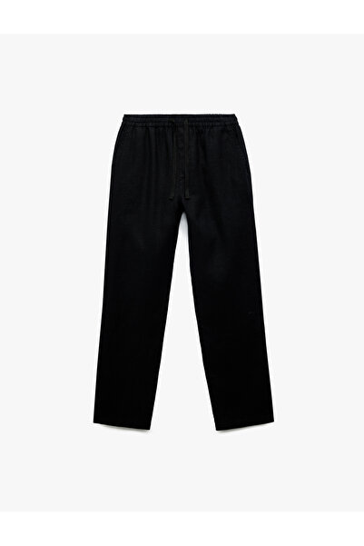 Koton بنطال تشينو من الكتان مع تفاصيل جيوب وأربطة على الخصر