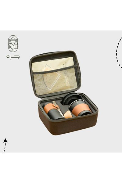 Jarrah The distinctive package is an integrated manual coffee preparation tool bag with a grinder, filter, funnel, and a storage container made of a jar.