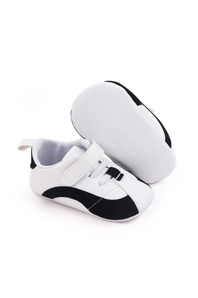 Superbaby Adidasi albi cu negru cu sireturi si bareta cu arici