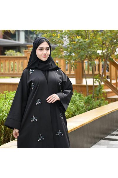 HAWRAA Embroidered and decorated abaya in green, blue and multi-colored crystals