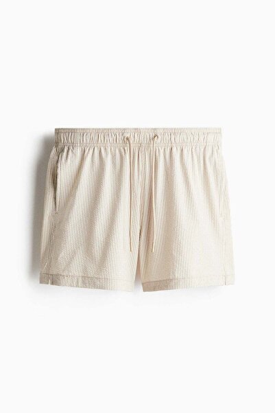 H&M شورت سباحة من قماش السيراكر