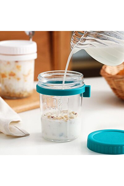 Quasar & Co. Set of 2 glasses with spoons Quasar & Co.®, graduated, to go, for breakfast, glass/stainless steel, yellow-turquoise