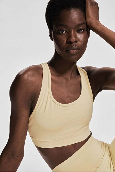 H&M حمالة صدر رياضية متوسطة الدعم مع SoftMove™