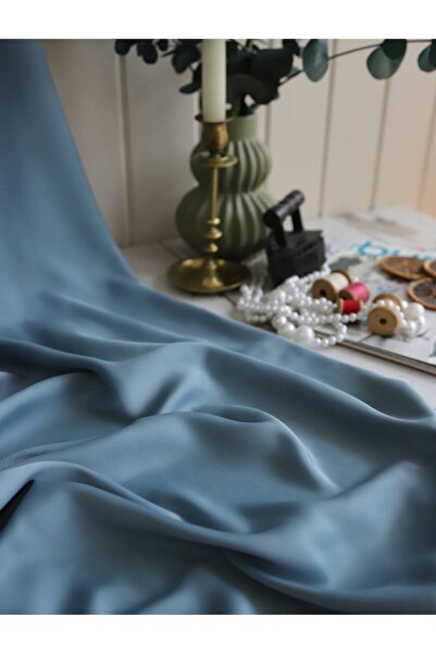 Parça Kumaş Dünyası Dubai İpeği Dökümlü kumaş Su Yeşili Rengindedir