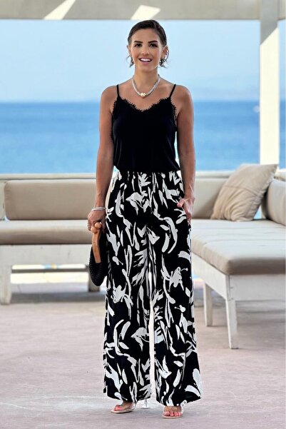 NEWCO Black Leaf Patterned Palazzo Trousers
