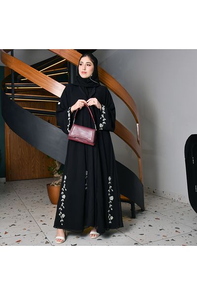 HAWRAA Black quarter-cloche wrap abaya decorated with elegant white and pink embroidery