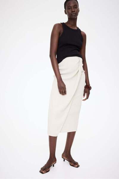 H&M تنورة ملفوفة من قماش الجيرسي المزخرف من ماما