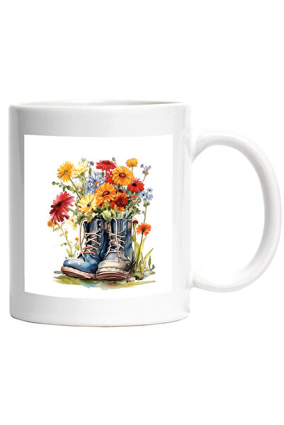 StoryGift Romania Cana cu niste incaltari in care sunt flori | pe post de ghi...