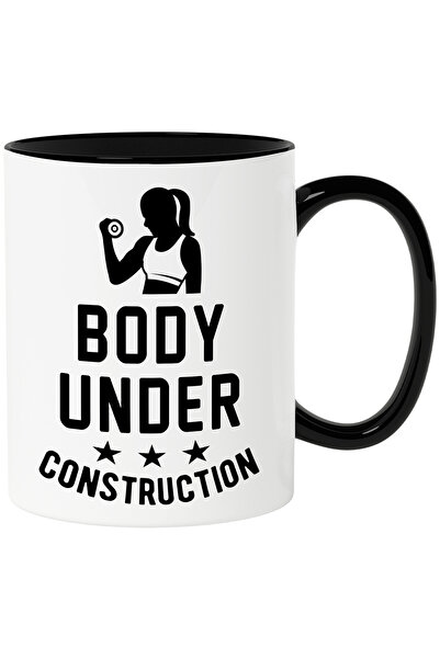 StoryGift Romania Cana cu o figura de femeie si textul "Body under constructi...