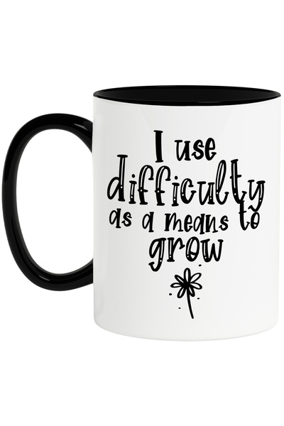 StoryGift Romania Cana cu o floare si mesajul "Folosesc dificultatea pentru a...