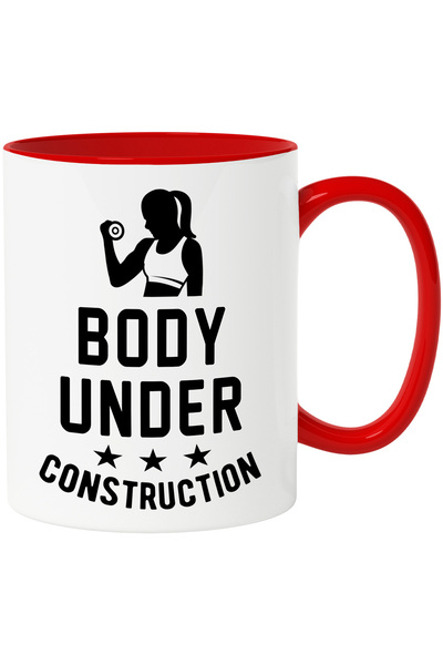 StoryGift Romania Cana cu o figura de femeie si textul "Body under constructi...