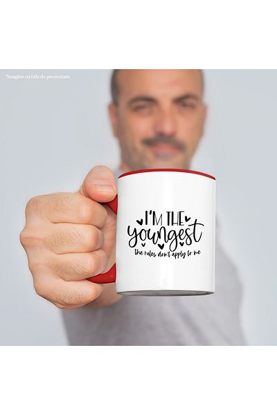 StoryGift Romania Mug with hearts and the text "I'm the youngest, the rules don't apply to me" with Ma, Cu, STG.