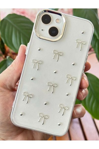 Fibaks حافظة Apple Iphone 14 Plus / 15 Plus مزينة بفيونكة شفافة فضية لامعة وكاميرا بارزة