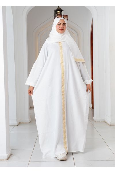 SIDRAALMONTAHA The white abaya embroidered with gold threads is elegant and luxurious.