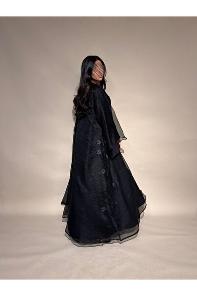 outline Black abaya made of silk taffeta with prominent roses