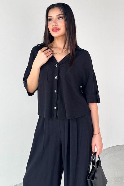 Cappmoda TKM-13303 طقم قميص أسود بأكمام قصيرة وجيب وبنطلون فضفاض مرن مكون من قطعتين