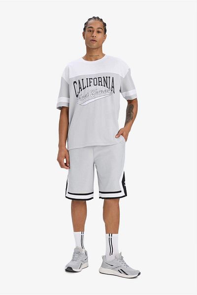 DeFacto Fit Quick Dry Oversize Φαρδύ μπλουζάκι με λαιμόκοψη με στάμπα αθλητικό κοντομάνικο μπλουζάκι E4122ax